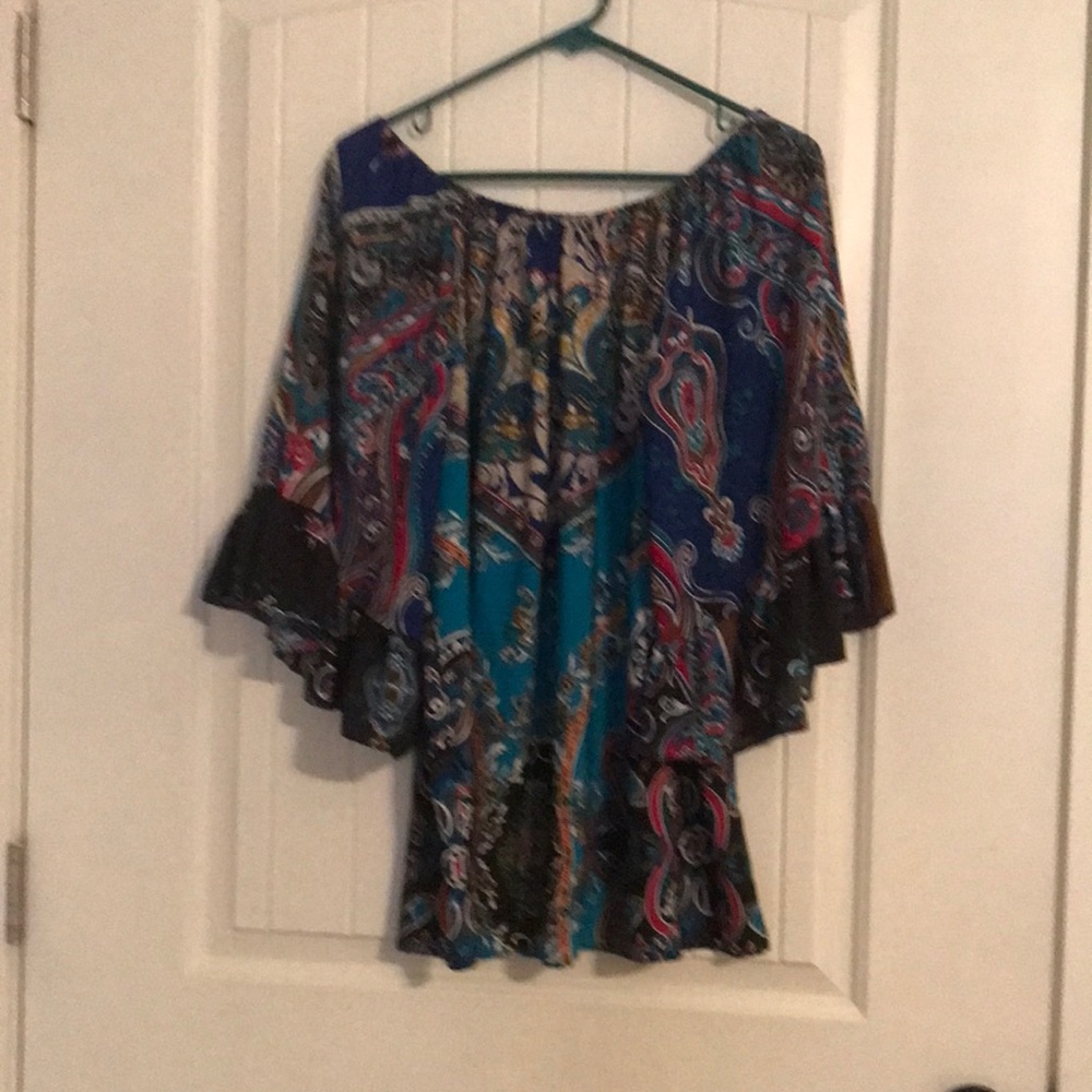Pretty flowing top. Teal , black, tan and rich red